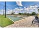 Two bocce ball courts with ample seating under a sunny sky at 2717 Greenlands St, St Cloud, FL 34772