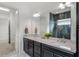 Bathroom with a double vanity and granite countertop at 2717 Greenlands St, Saint Cloud, FL 34772