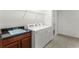 Bright laundry room with washer, dryer, and ample cabinetry at 2717 Greenlands St, St Cloud, FL 34772