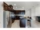 Modern kitchen with dark wood cabinets and island at 2717 Greenlands St, St Cloud, FL 34772