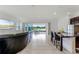 Open living room with water view and kitchen island at 2717 Greenlands St, St Cloud, FL 34772