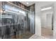 Modern bathroom with glass-enclosed shower and walk-in closet at 2717 Greenlands St, St Cloud, FL 34772