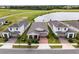 Aerial view of three houses with similar architecture and landscaping at 2717 Greenlands St, St Cloud, FL 34772