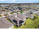 Aerial view of a house with solar panels in a residential area at 2717 Greenlands St, St Cloud, FL 34772