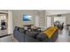 Living room with a gray couch and a large TV at 188 Ridgemont Ct, Davenport, FL 33896