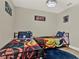 bedroom with two twin beds and Marvel decor at 188 Ridgemont Ct, Davenport, FL 33896