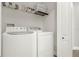 Laundry room with washer, dryer, and overhead shelving at 188 Ridgemont Ct, Davenport, FL 33896