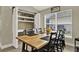 Dining room with a large wooden table and barn door at 188 Ridgemont Ct, Davenport, FL 33896