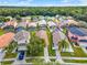 Aerial view of houses in a community with lush green surroundings at 188 Ridgemont Ct, Davenport, FL 33896