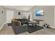 Living room with sectional sofa and large TV at 188 Ridgemont Ct, Davenport, FL 33896