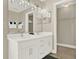 Double vanity bathroom with white cabinets and a walk-in shower at 188 Ridgemont Ct, Davenport, FL 33896