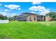 Landscaped backyard with a screened pool and patio at 188 Ridgemont Ct, Davenport, FL 33896