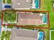 High-angle view of house and surrounding neighborhood, showing property lines at 188 Ridgemont Ct, Davenport, FL 33896