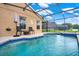 Inviting screened-in pool with patio furniture at 188 Ridgemont Ct, Davenport, FL 33896