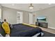Spacious bedroom with a large TV and en-suite bathroom at 188 Ridgemont Ct, Davenport, FL 33896