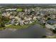 Large-scale aerial view showing community and lakefront home at 957 Whispering Cypress Ln, Orlando, FL 32824