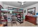 Charming bedroom featuring a loft bed, desk, and dresser at 1154 Sea Pines Ct, Tavares, FL 32778