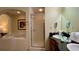 Bathroom with a shower, double vanity, and a large bathtub at 8101 Resort Village Dr, Orlando, FL 32821