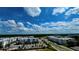 Aerial view of a community with multiple apartment buildings, parking lots, and landscaping at 8101 Resort Village Dr, Orlando, FL 32821