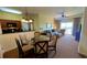 Open dining area with kitchen and living room view at 8101 Resort Village Dr, Orlando, FL 32821