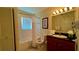 Clean bathroom with tub, toilet and granite vanity at 8101 Resort Village Dr, Orlando, FL 32821