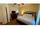 King-size bed, dresser, and TV in spacious bedroom at 8101 Resort Village Dr, Orlando, FL 32821