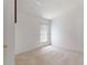 Simple bedroom with carpet flooring and a window allowing in natural light at 117 Verbena St, Davenport, FL 33837