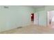 Bedroom with carpet flooring and an open door to another room at 117 Verbena St, Davenport, FL 33837