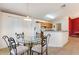 Kitchen with breakfast nook, white appliances, and wood cabinets at 117 Verbena St, Davenport, FL 33837