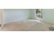 Light green walls and carpeted floor in this simple bedroom at 117 Verbena St, Davenport, FL 33837
