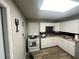 White kitchen with ample cabinetry and appliances at 1025 Susan St, Leesburg, FL 34748