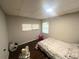 Bedroom with wood floors and a double window at 1025 Susan St, Leesburg, FL 34748