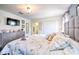 Main bedroom with king-size bed and en-suite bathroom at 8988 Stinger Dr, Champions Gate, FL 33896