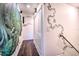 Hallway featuring a vibrant jungle mural and vines at 8988 Stinger Dr, Champions Gate, FL 33896