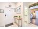 Inviting entryway with console table and views into bathroom and bedroom at 8988 Stinger Dr, Champions Gate, FL 33896