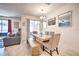 Rustic dining table with bench seating in open concept space at 8988 Stinger Dr, Champions Gate, FL 33896