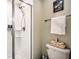 Bathroom with shower, toilet and nautical-themed decor at 8988 Stinger Dr, Champions Gate, FL 33896