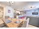 Open concept dining room with kitchen and living room views at 8988 Stinger Dr, Champions Gate, FL 33896