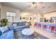 Open concept living and kitchen area with playful decor at 8988 Stinger Dr, Champions Gate, FL 33896