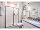 Clean bathroom with walk-in shower, toilet and vanity at 8988 Stinger Dr, Champions Gate, FL 33896