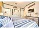 Main bedroom with king-size bed and tropical decor at 8988 Stinger Dr, Champions Gate, FL 33896