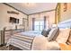 Main bedroom with a king-size bed, dresser and TV at 8988 Stinger Dr, Champions Gate, FL 33896