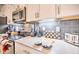 Well-equipped kitchen featuring modern appliances and ample counter space at 8988 Stinger Dr, Champions Gate, FL 33896