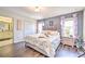 Main bedroom with king-size bed and en-suite bathroom at 8988 Stinger Dr, Champions Gate, FL 33896