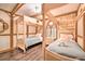 Two twin beds in a fairytale-themed bedroom with stained glass window at 8988 Stinger Dr, Champions Gate, FL 33896