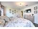 Charming bedroom with a comfy bed and Parisian-themed decor at 8988 Stinger Dr, Champions Gate, FL 33896