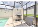 Enjoy grilling and dining by the pool with this convenient outdoor kitchen at 8988 Stinger Dr, Champions Gate, FL 33896