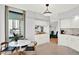 White kitchen with breakfast nook and balcony access at 322 E Central Blvd # 901, Orlando, FL 32801