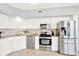 Modern kitchen featuring stainless steel appliances and granite countertops at 322 E Central Blvd # 901, Orlando, FL 32801