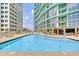 Resort-style rooftop pool with plenty of lounge chairs at 322 E Central Blvd # 901, Orlando, FL 32801